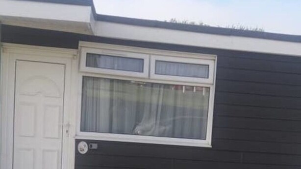 A house with a white door and a window with white curtains. - 2 Bedroom Chalet Near the Beach (Sandown)