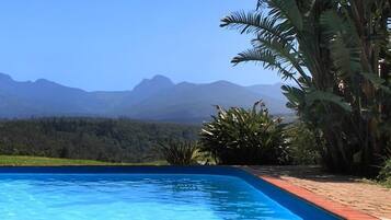 Outdoor pool, pool umbrellas, sun loungers