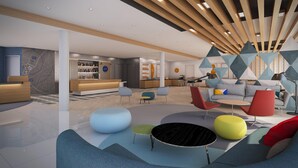 Um hall moderno com balcão de recepção, área de estar e bar.