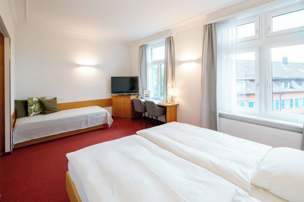 comfort triple room | individually furnished, desk, laptop workspace, blackout curtains