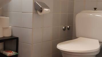 Apartment | Bathroom | Bathtub, hair dryer, towels, soap