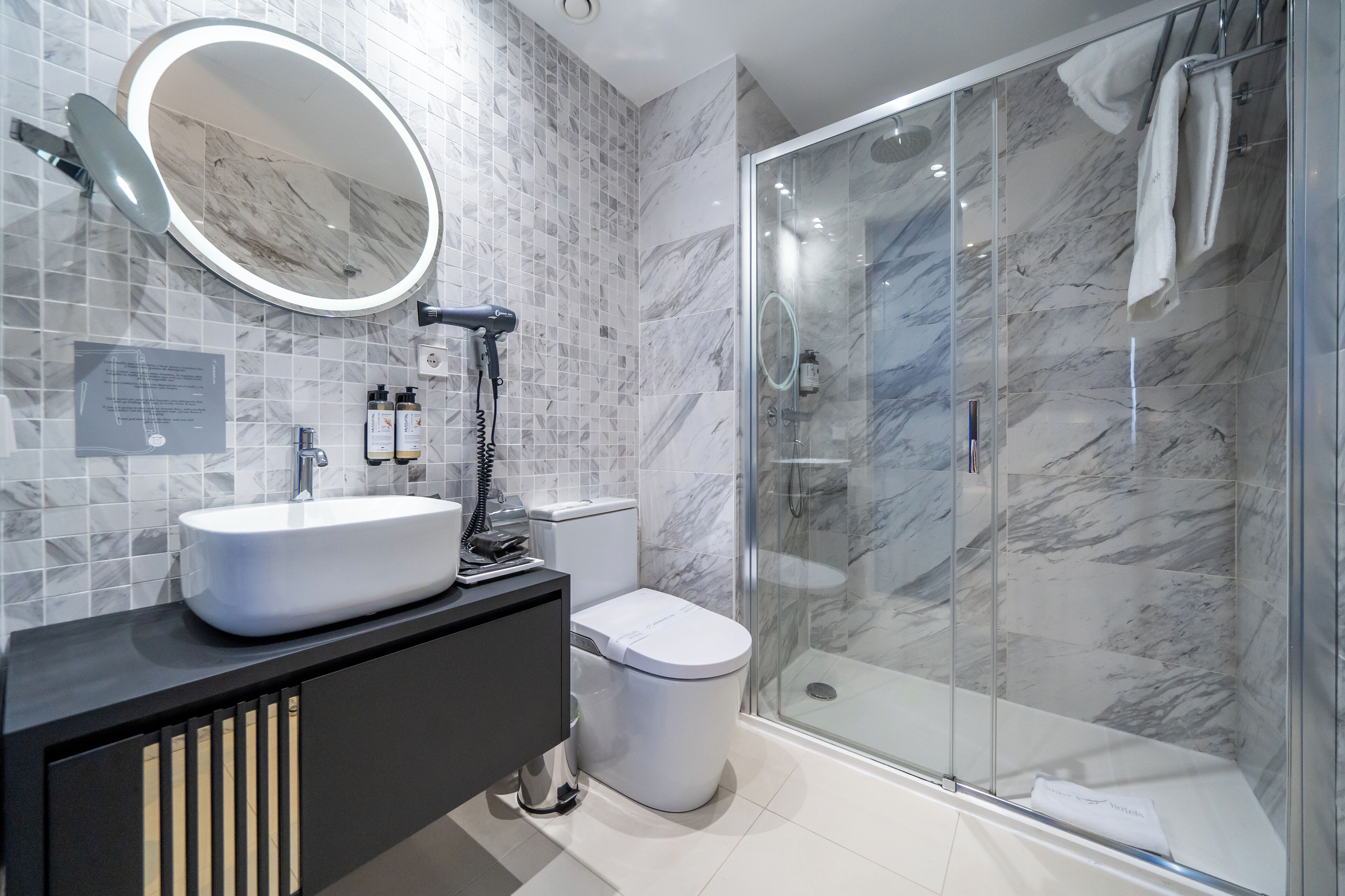 shower, rainfall showerhead, designer toiletries, hair dryer