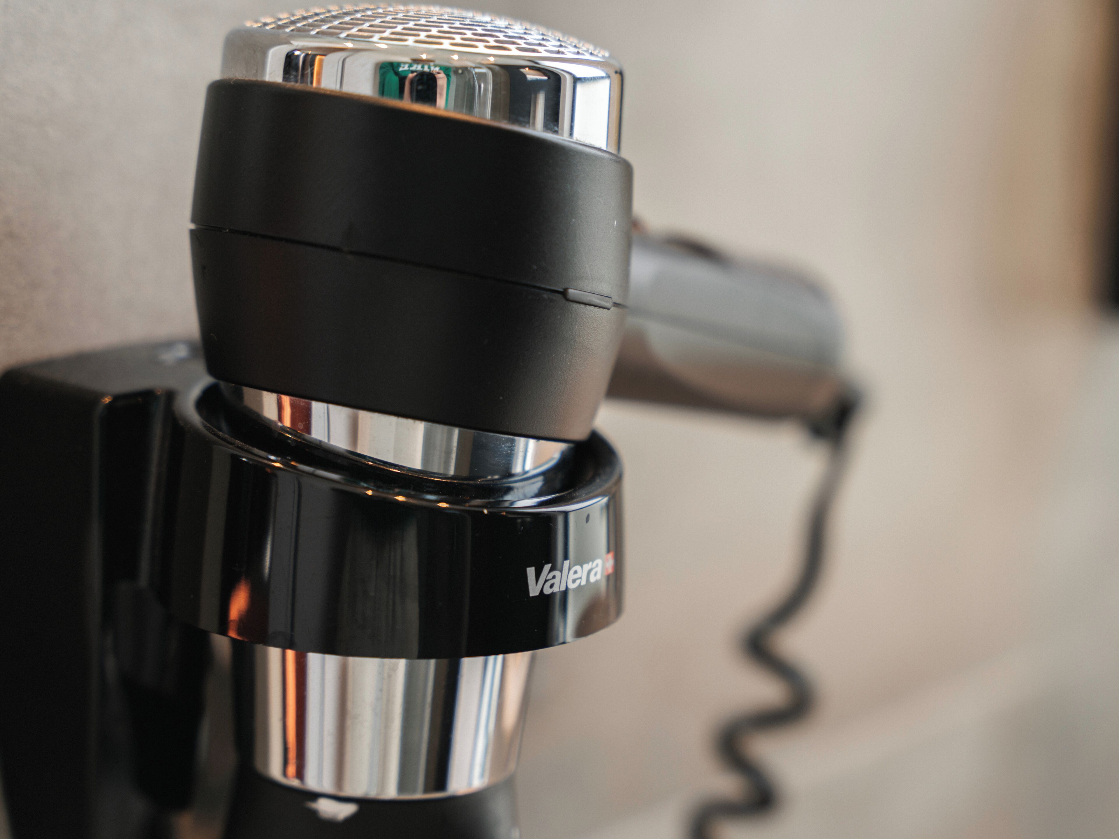 A microphone with a cord plugged into it.