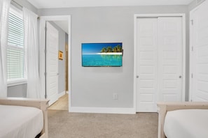 Cozy Twins: Retreat to our charming bedroom with two single beds, where comfort and convenience come together for a delightful stay. - Pool Home! 5BR w Patio & Free Parking near Disney (Kissimmee)