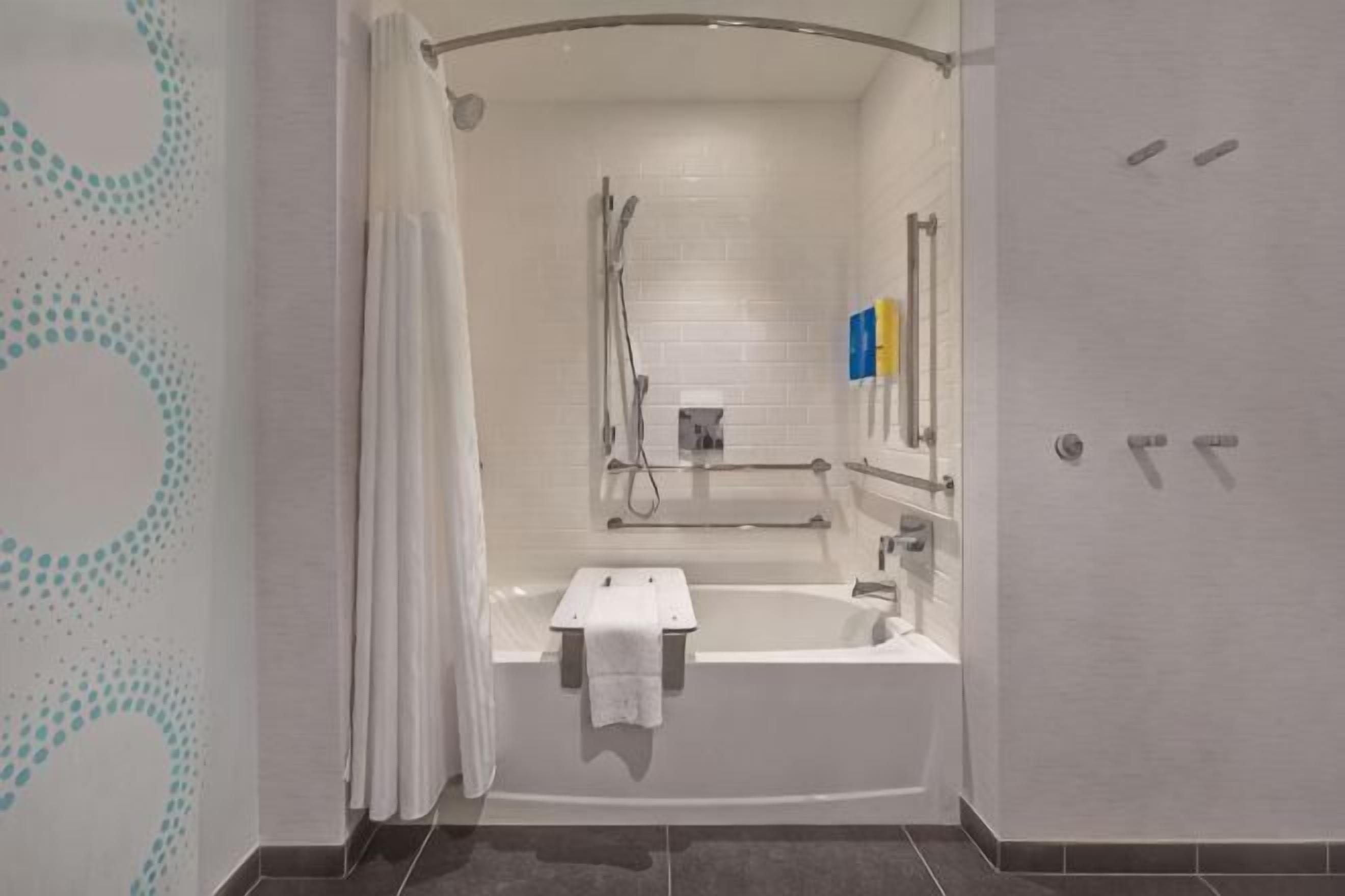 Combined shower/tub, hair dryer, towels, soap