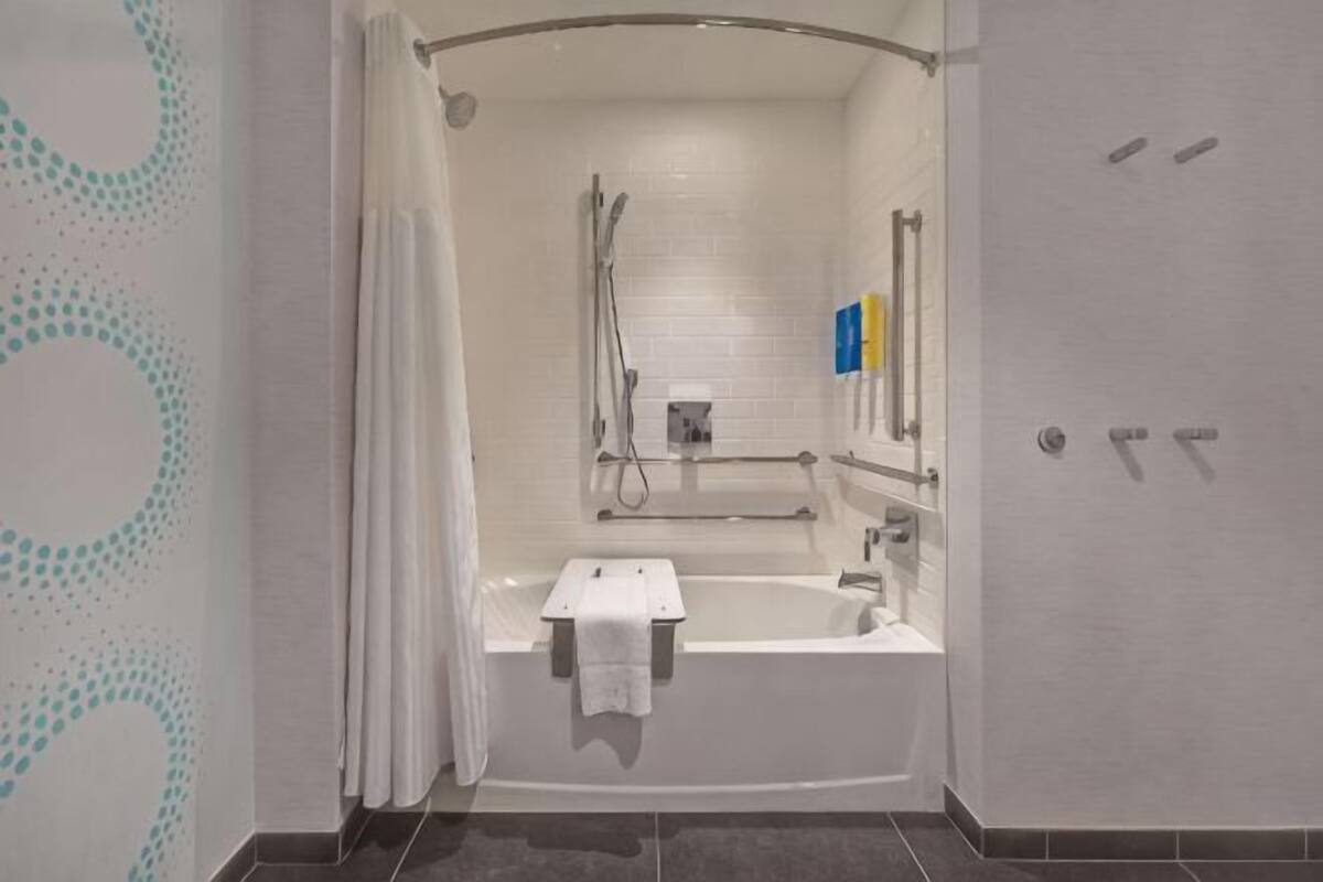 Combined shower/tub, hair dryer, towels, soap
