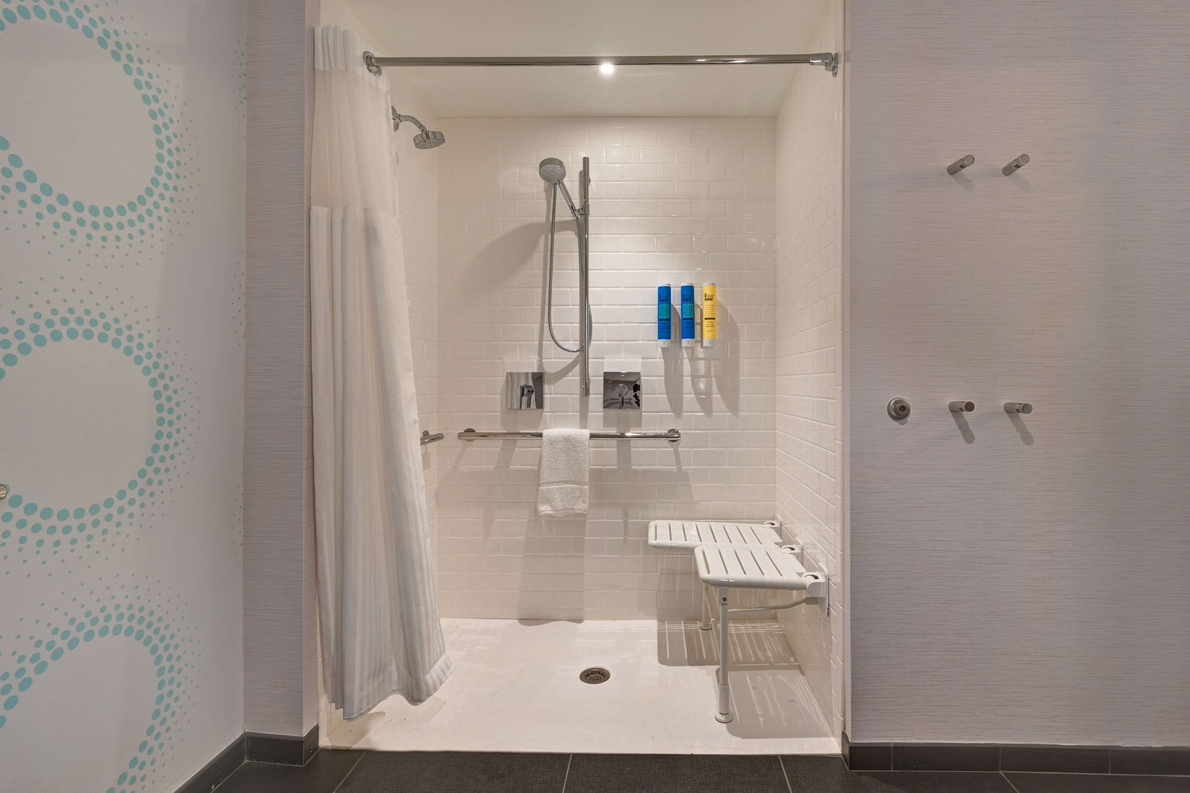 combined shower/bathtub, hair dryer, towels, soap