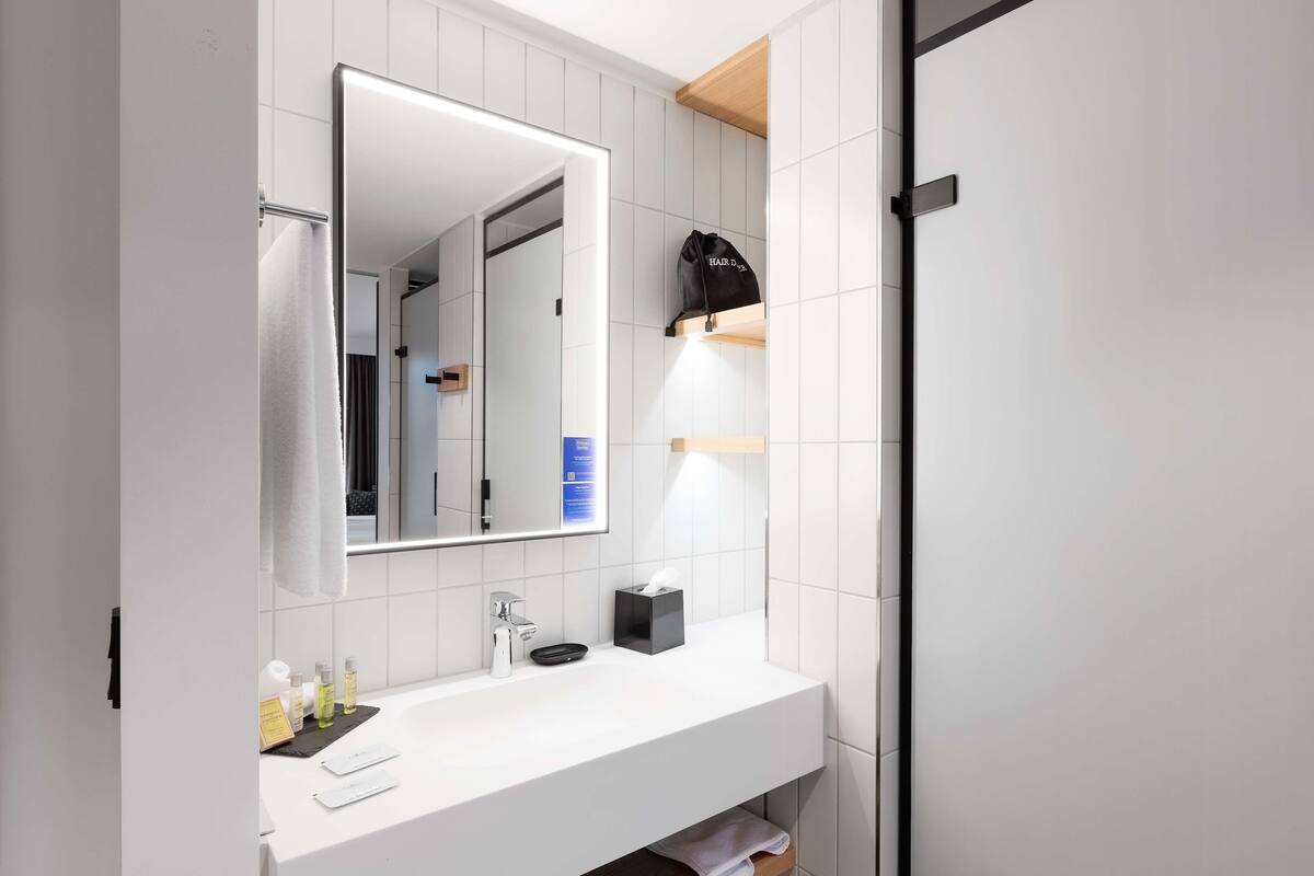 shower, rainfall showerhead, hair dryer, towels