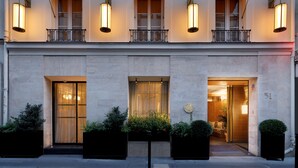 A hotel facade with multiple balconies, large windows, and a welcoming entrance. - Le Belgrand Hotel Paris Champs Elysees, Tapestry by Hilton (Paris)
