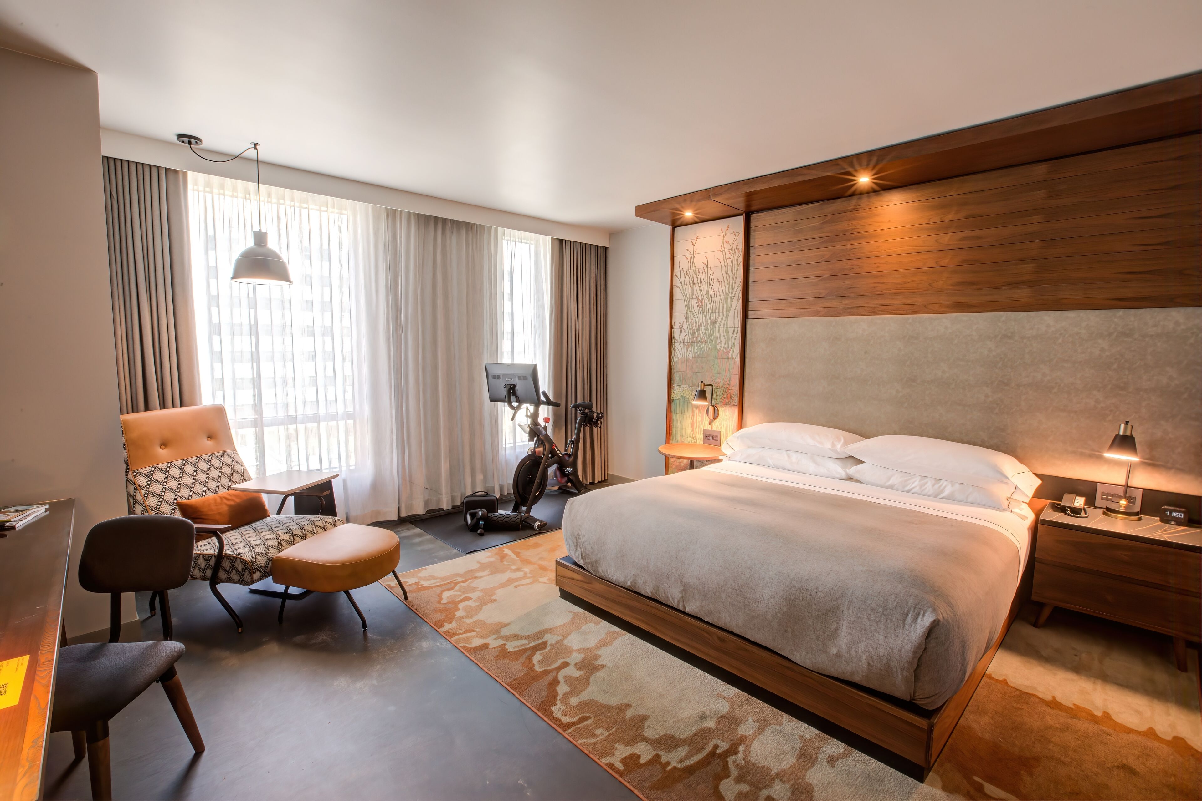 room, 1 king bed (peloton wellness room) | in-room safe, desk, laptop workspace, blackout curtains