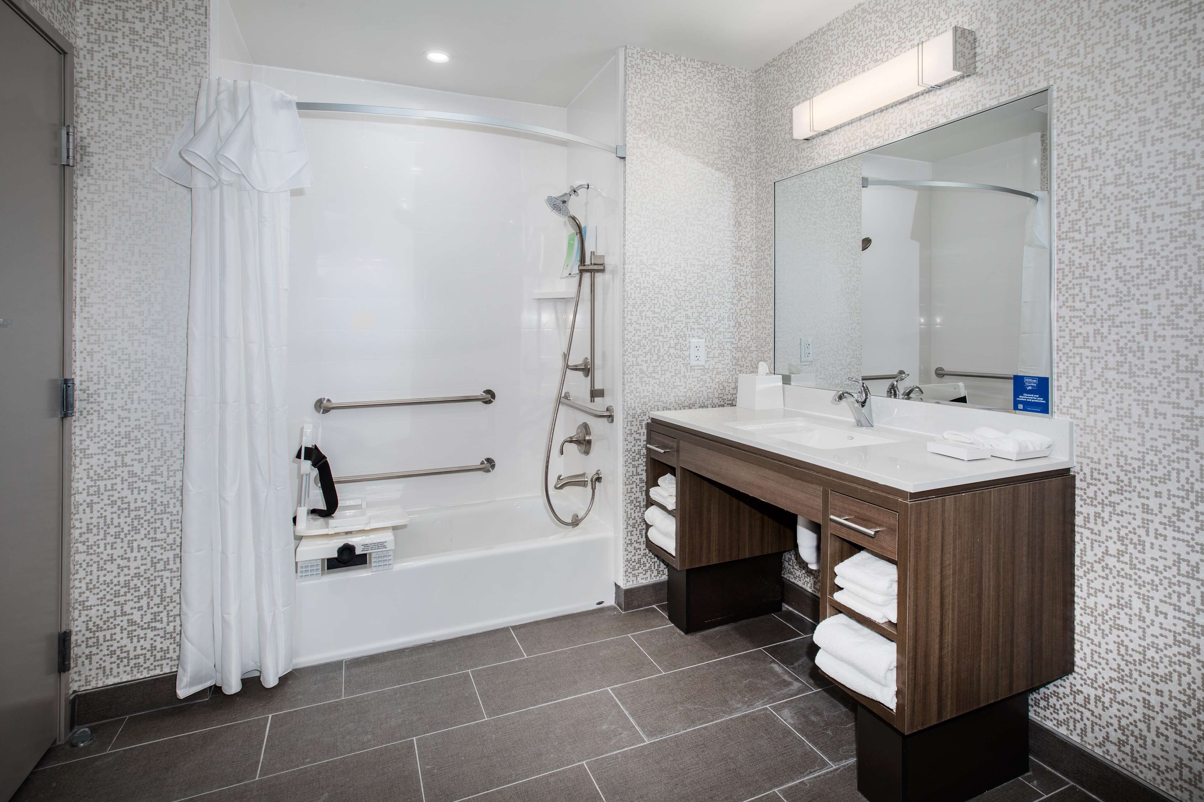 suite, 1 king bed, accessible, bathtub (mobility & hearing) | bathroom | hair dryer, towels, soap, shampoo