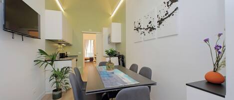 Greenfour Rome Apartment | Private kitchen | Full-size fridge, microwave, oven, stovetop