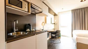 Fridge, electric kettle, high chair