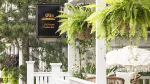 A Life House Nantucket sign, white railings, and hanging ferns. - Life House, Nantucket (Nantucket)
