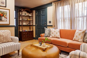 Luxury Triple Room | Living area | 40-inch TV with cable channels