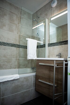 Combined shower/tub, hair dryer, towels, soap