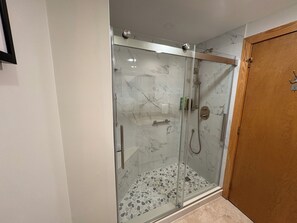 Combined shower/tub, hair dryer, towels, soap