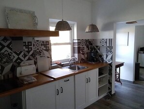 Fridge, microwave, stovetop, coffee/tea maker