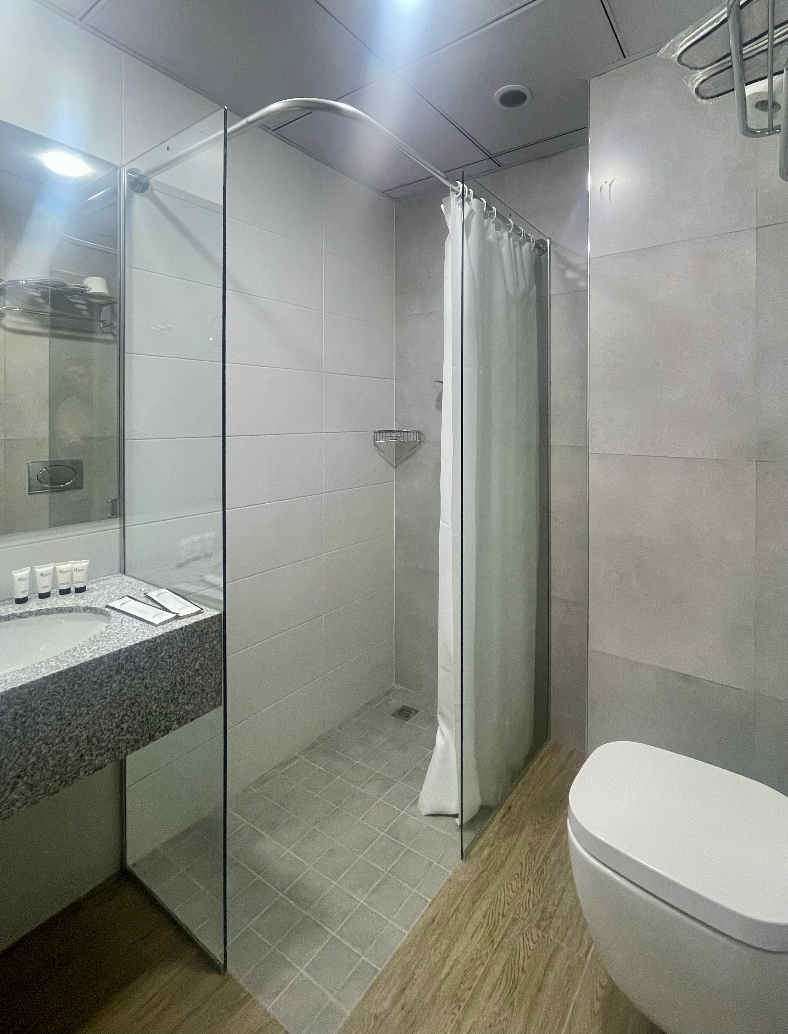 shower, eco-friendly toiletries, hair dryer, slippers