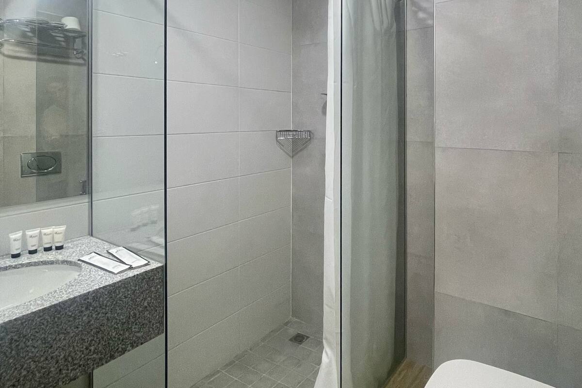 shower, eco-friendly toiletries, hair dryer, slippers