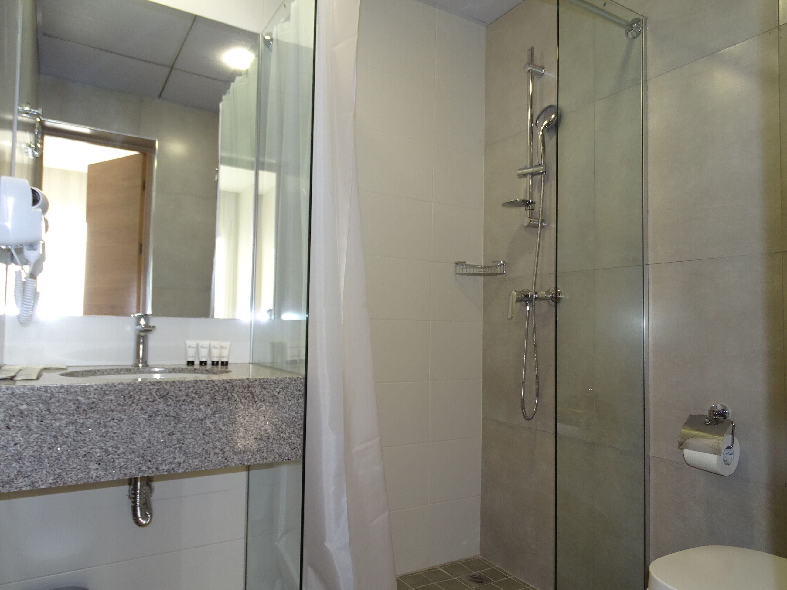 shower, eco-friendly toiletries, hair dryer, slippers