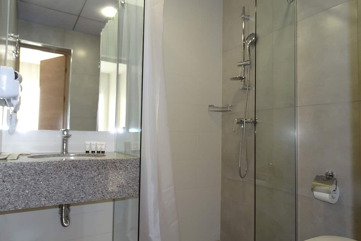 shower, eco-friendly toiletries, hair dryer, slippers