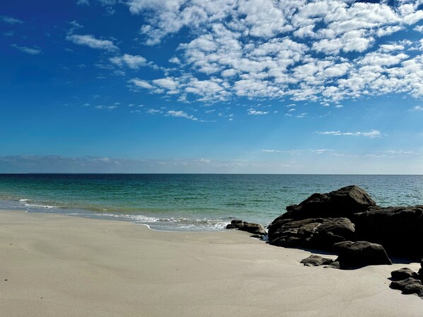 On the beach, sun loungers