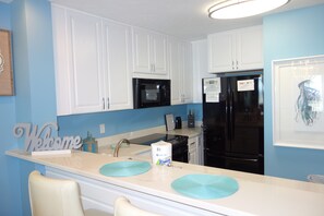 Fridge, microwave, oven, stovetop - Summer House 105<br>Let the peacefulness of the blue sky follow you in to this beautifully decorated 3 bedroom 2 bath condo! (Mexico Beach)