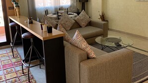 Deluxe Apartment, 1 Bedroom, Balcony, Pool View | Living area | 42-inch flat-screen TV with digital channels, TV, DVD player - Babylone 1 (Marrakech)