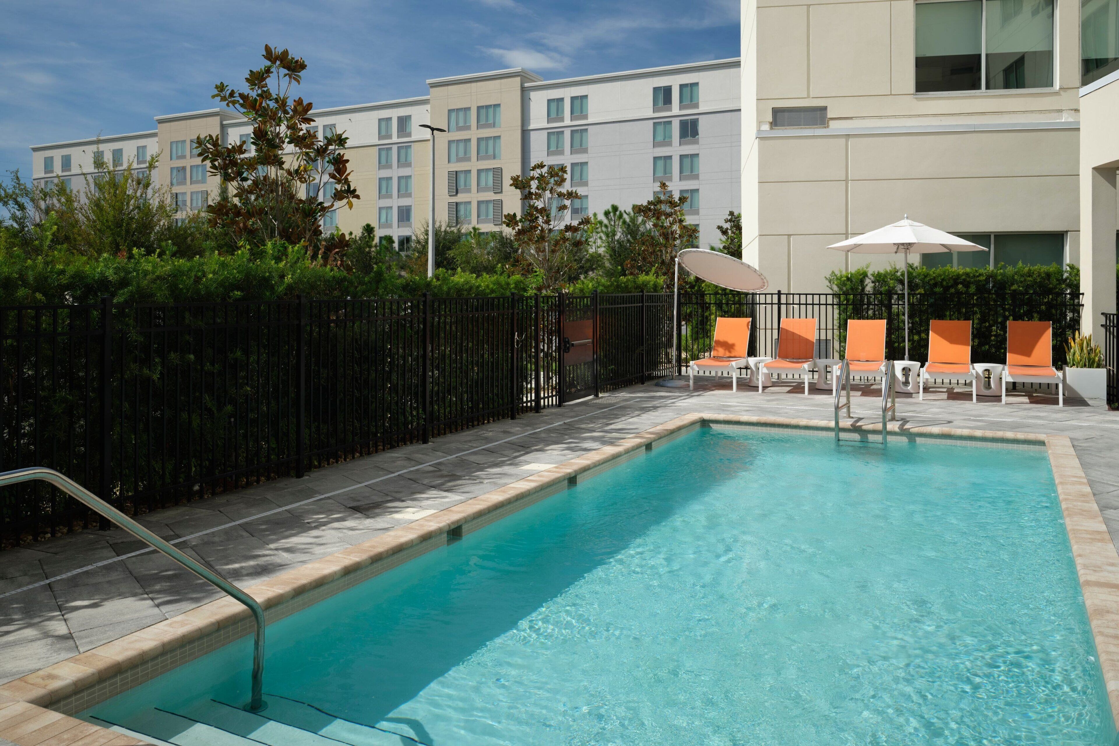 outdoor pool, pool umbrellas, pool loungers