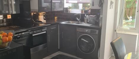 Coffee/tea maker, fridge, microwave, oven
