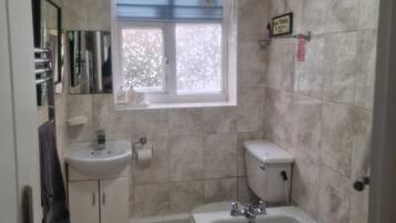 Combined shower/tub, hair dryer, towels, toilet paper