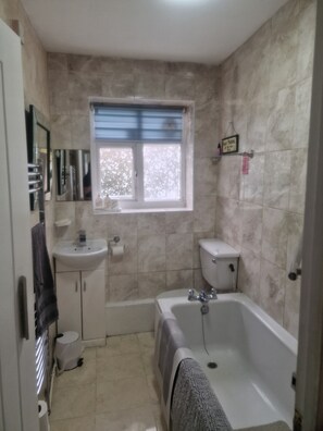 Combined shower/tub, hair dryer, towels, toilet paper