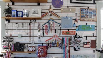 A store with various items on display including jewelry, souvenirs, and a map.