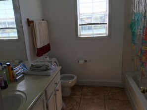 Combined shower/tub, hair dryer, towels, soap
