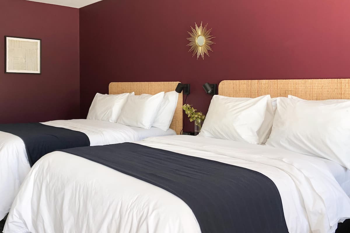 Premium bedding, pillowtop beds, laptop workspace, blackout drapes