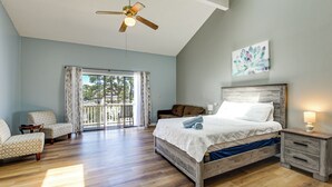 A bedroom with a bed, a nightstand, a chair, a ceiling fan, and a window with curtains. - 4 Mi to Cherry Grove Beach: Studio w/ Pool Access (Little River)