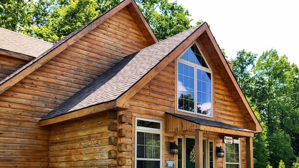 A log cabin with a front porch, a large window, and a sign reading "Meadow View". - Spacious cabin with Hot Tub and wood burning fireplace and wi-fi (Campton)