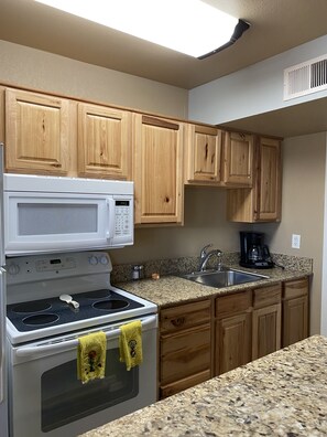 Microwave, coffee/tea maker, cookware/dishes/utensils