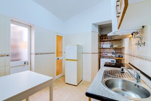 Fridge, electric kettle, toaster, cookware/dishes/utensils