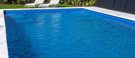 Seasonal outdoor pool, open 7:00 AM to 8:00 PM, pool loungers