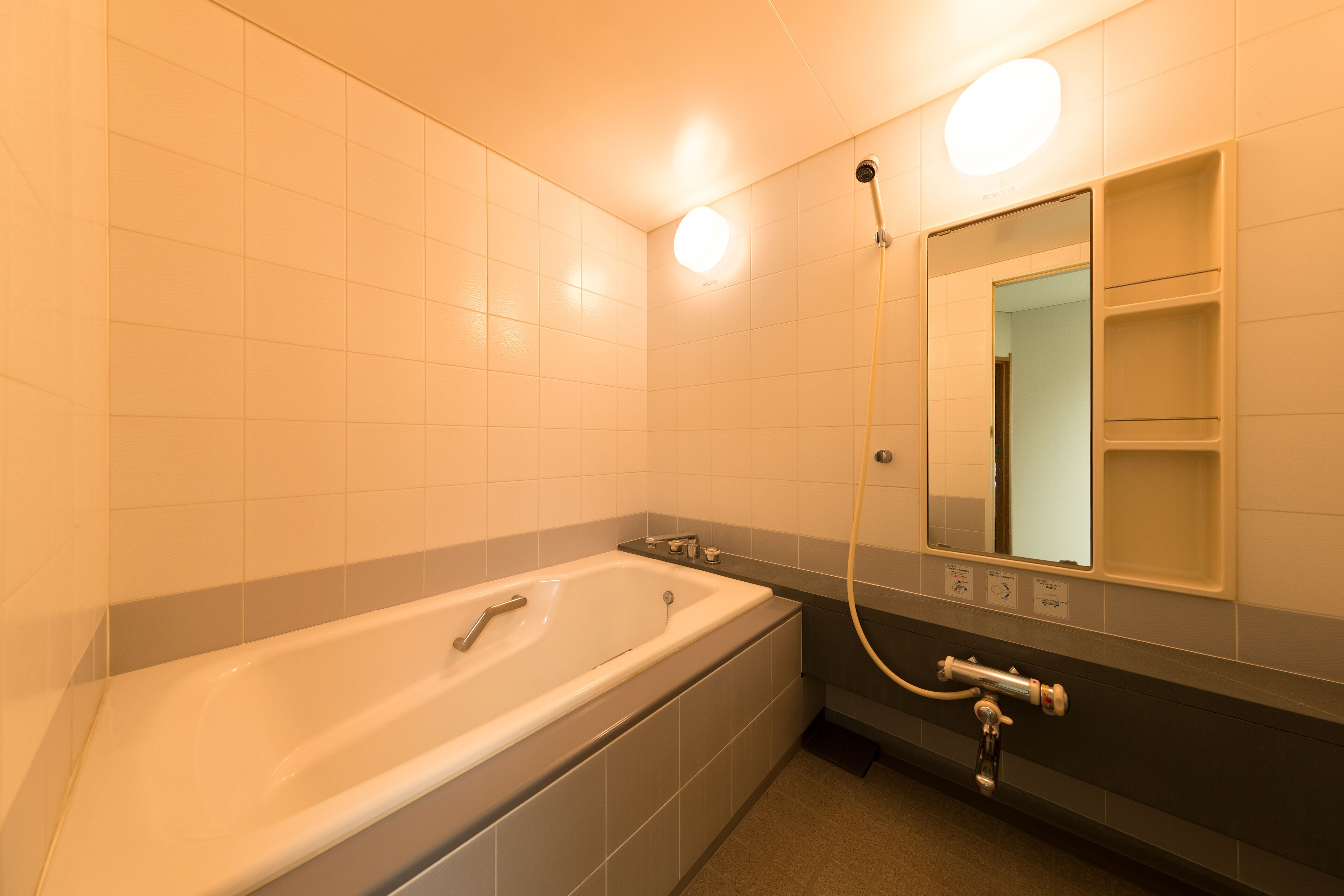 combined shower/bathtub, free toiletries, hair dryer, slippers