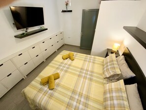 2 dormitorios, caja fuerte, tabla de planchar con plancha y wifi gratis