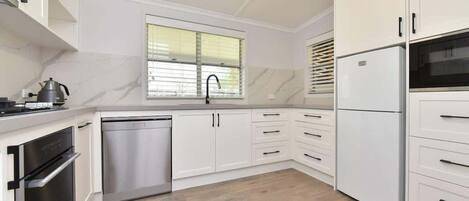 Coffee/tea maker, fridge, microwave, oven
