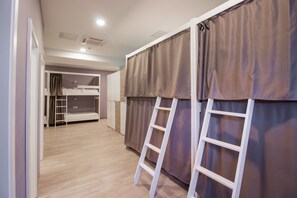 A room with bunk beds, a ladder, and a wooden floor. - Dandelion boutique hostel (Zadar)