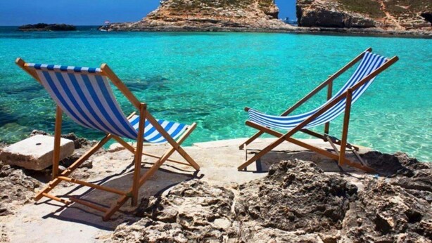 Two striped beach chairs on a rocky shore with clear turquoise water and a rocky island in the background. - Luxury 4 Bedroom Villa With Private Pool, Sotira Villa 1301 (Sotira)