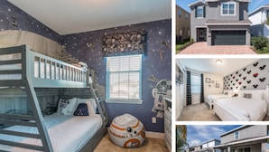 A bedroom with bunk beds, a Star Wars-themed wall, and a window. - Villa in Encore Resort at Reunion 3438 (Kissimmee)