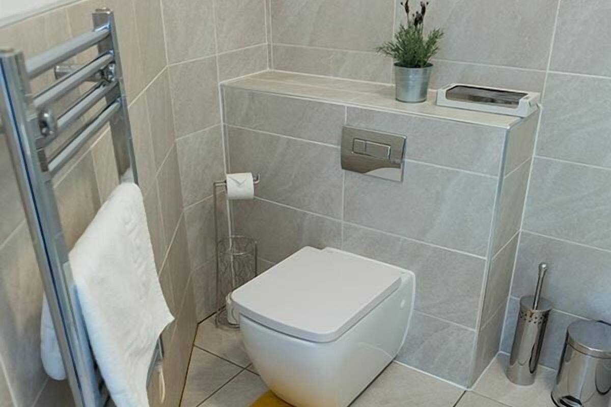 Apartamento executivo | Banheiro | Secador de cabelo, toalhas de banho, sabonete, shampoo