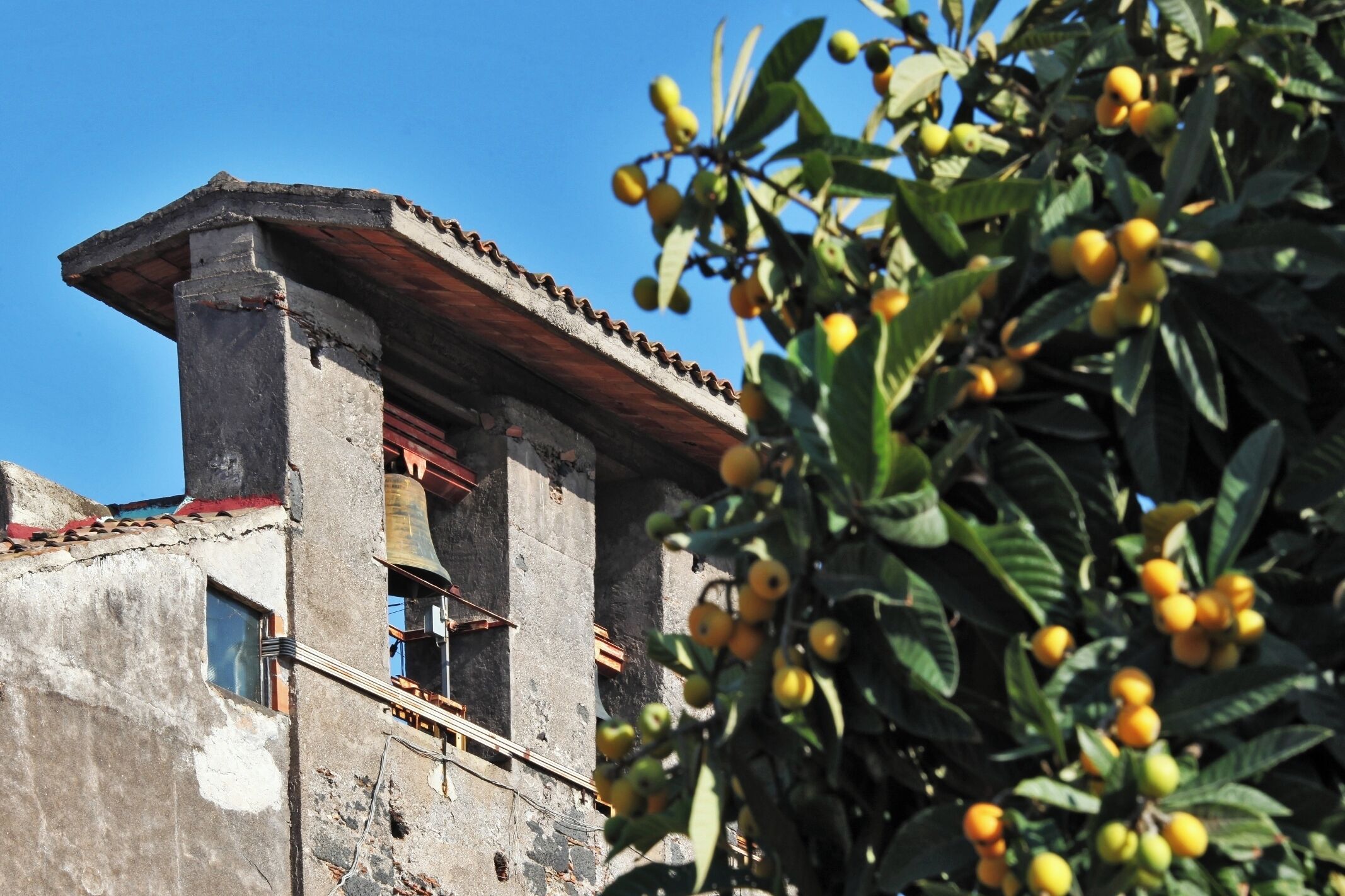 A building with a traditional architectural style, featuring a balcony and a window.