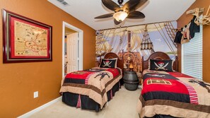 A bedroom with two beds, a ceiling fan, a map on the wall, and nautical-themed decorations. - Villa Close to Disney, Orlando Villa 3264 (Kissimmee)